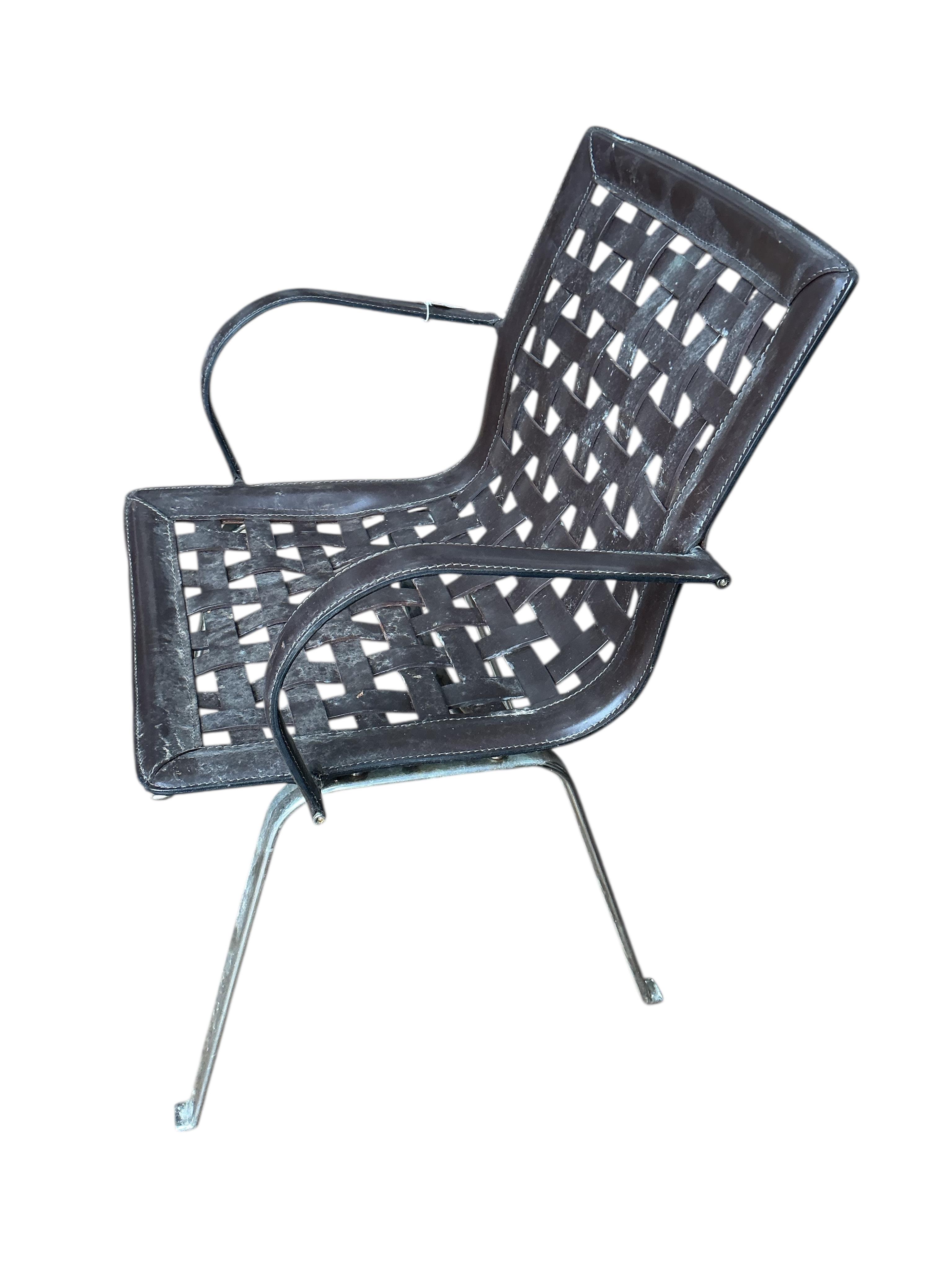 In the manner of Gancarlo for Faselhh: A set of four chrome and brown leather elbow chairs, width 62cm, depth 54cm, height 82cm